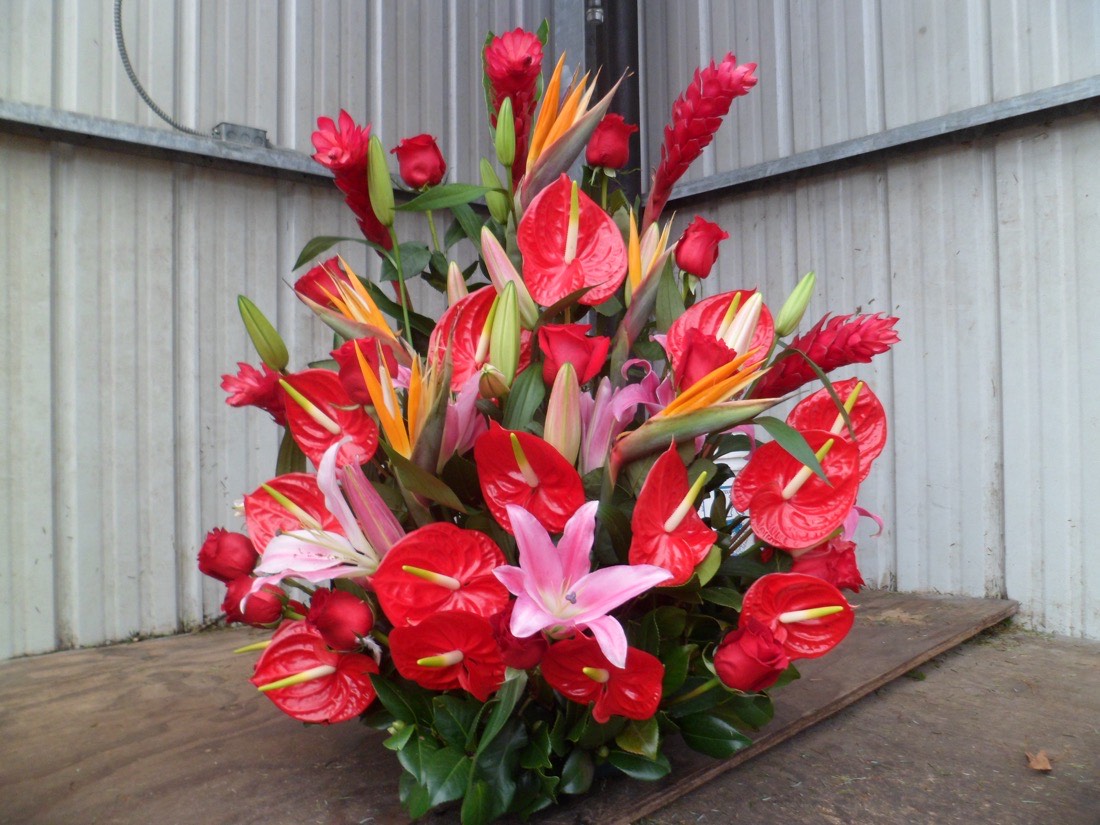 Tropical arrangement of anthuriums and lilies made at Tony's Greenery